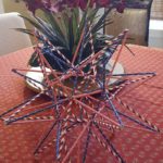 Straw star on a coffee table with a patriotic red/white/blue theme